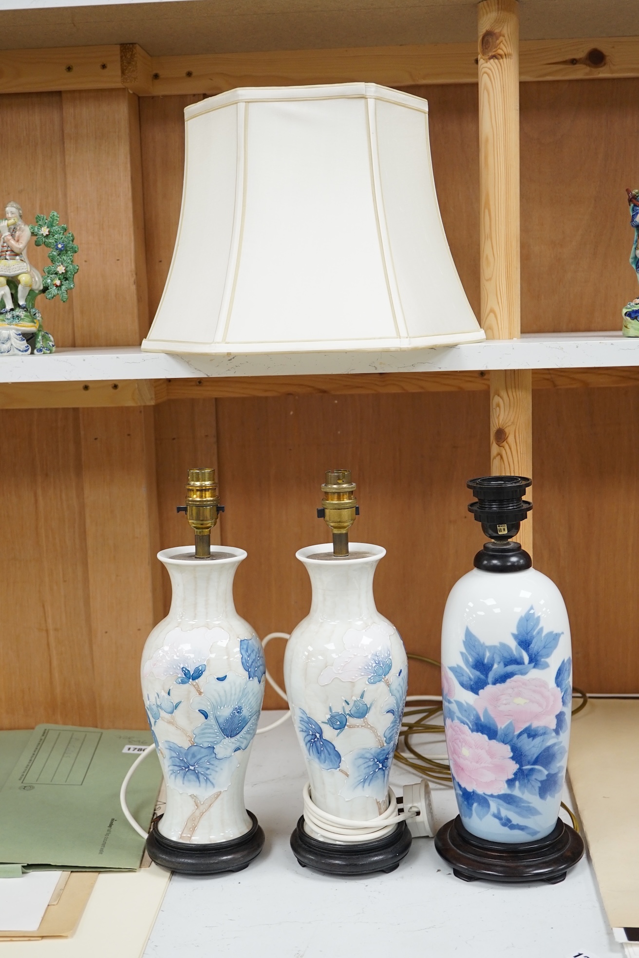 A pair of modern porcelain table lamps, and one other, one with shade (3). Condition - good, not tested